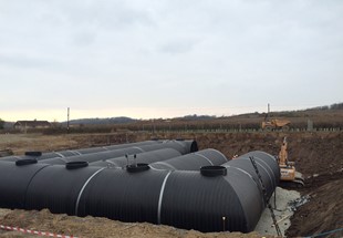 Use of 3.5 metre diameter plastic pipes to protect ecological market town