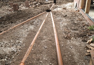 Designing drains and sewers for brownfield sites