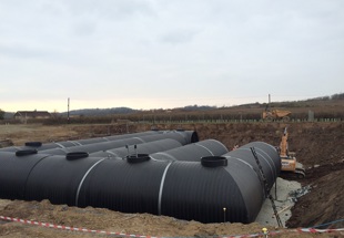Use of 3.5 metre diameter plastic pipes to protect ecological market town
